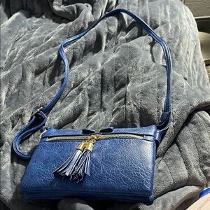 Elegant Blue Crossbody Bag with Tassel Accents